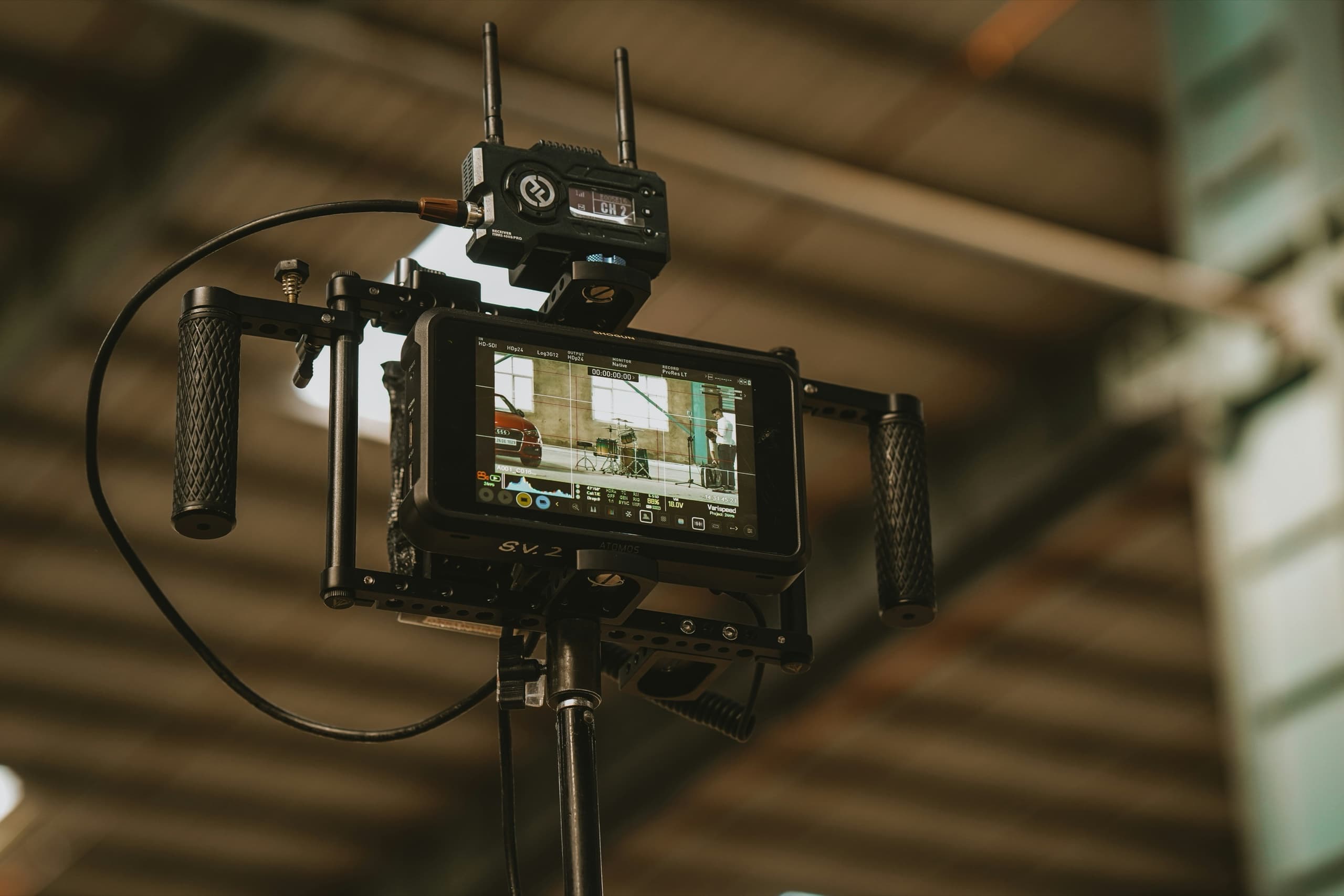 A wireless monitor rigged for framing and review on set.