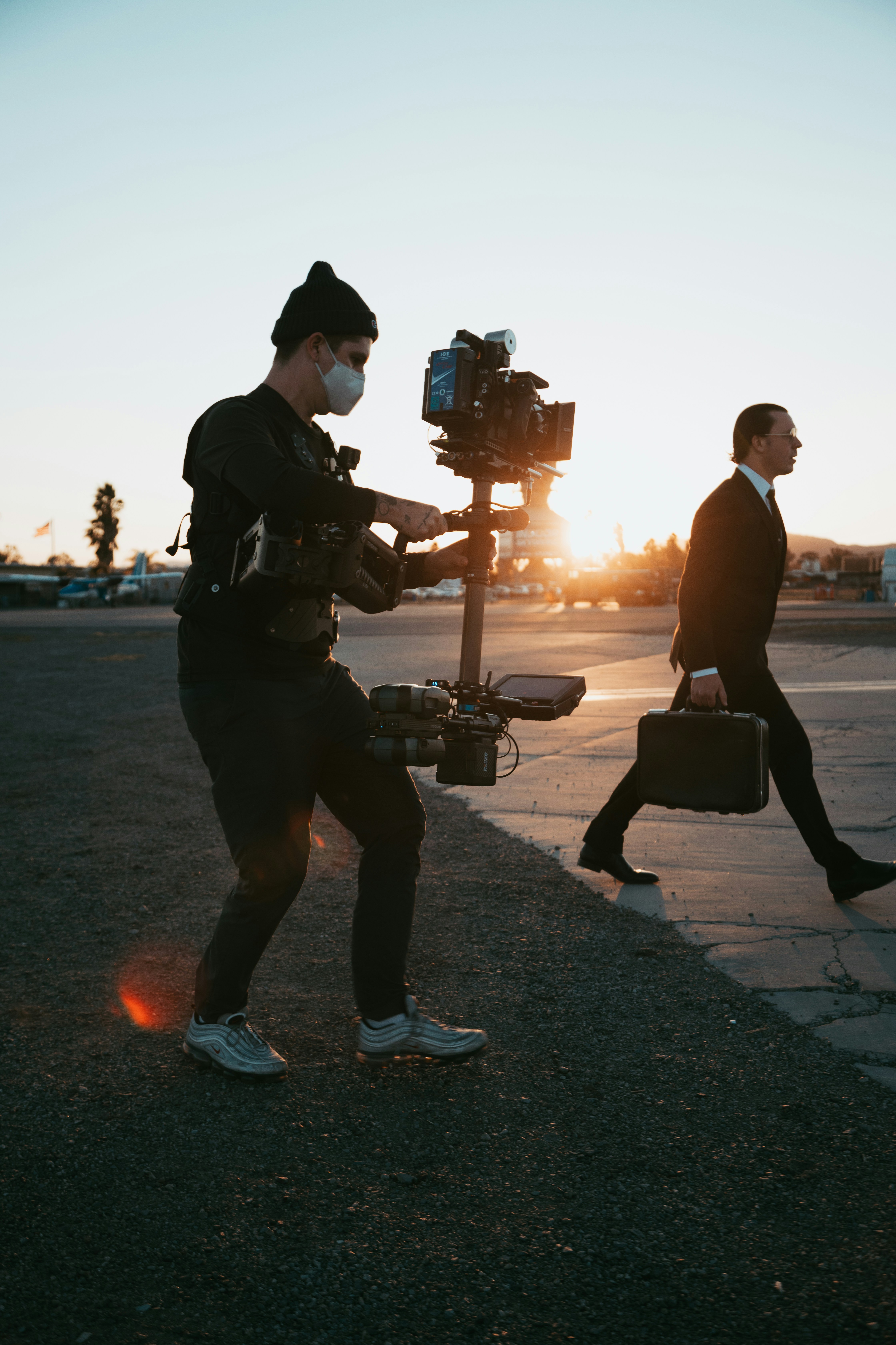 Steadicam operator following talent at sunset on a brand-film shoot.