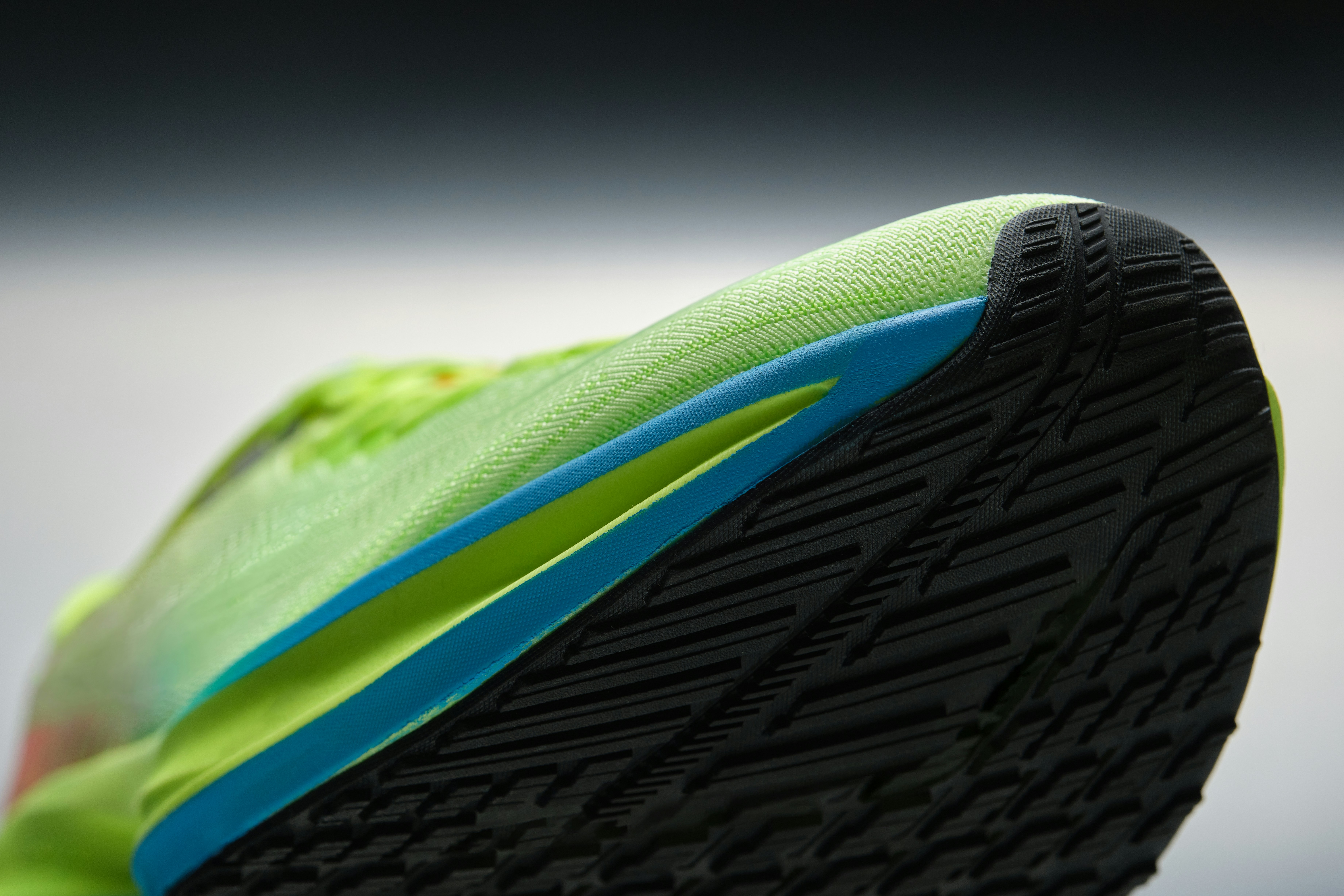 Footwear product photography, three-quarter detail shot under controlled studio light.