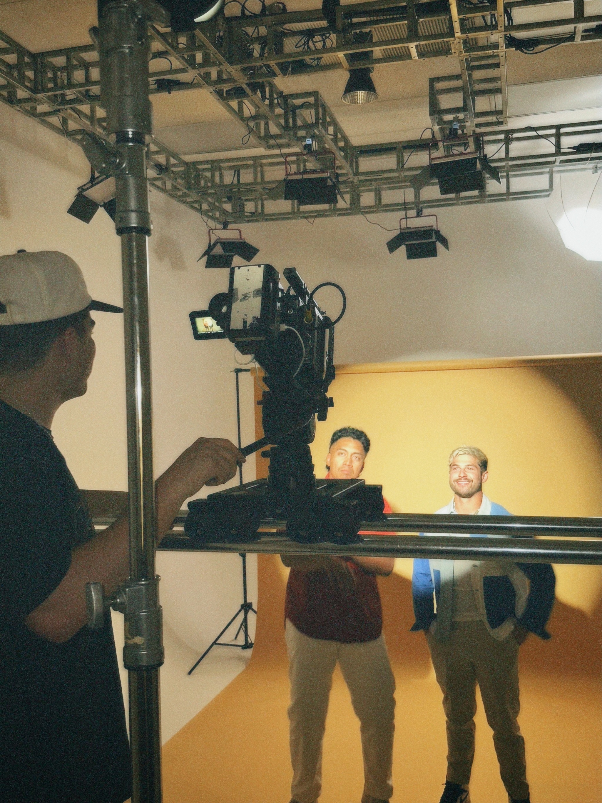 Talent on a stage set, slider locked, operator ready.