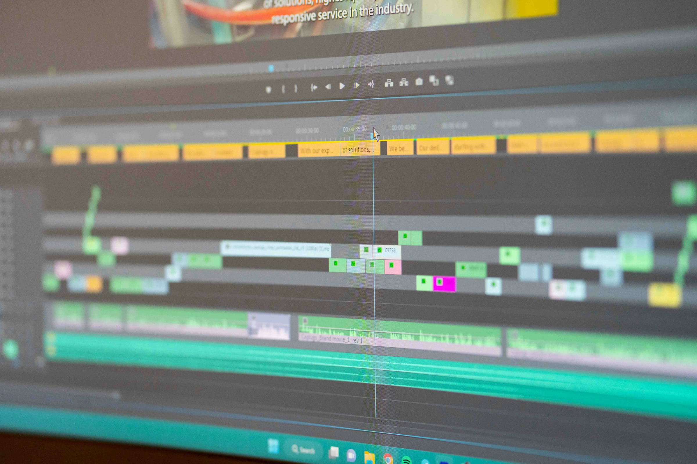 Color grading station with editor adjusting timeline